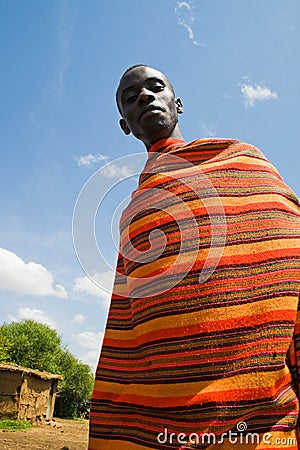 Masai with traditional colorful Masai blanket Stock Photo