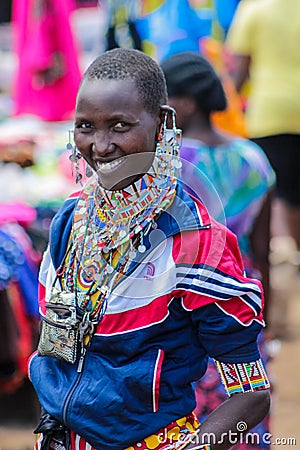 Masai tribe traditional dressed young woman smiling in Africa Editorial Stock Photo