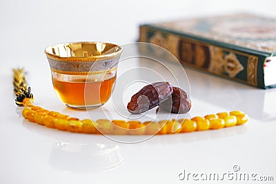 Masbaha, Quran, Arabic tea and dried dates are symbols of Ramadan Stock Photo