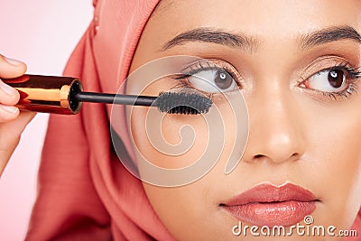 Mascara brush, beauty and face of Muslim woman with studio cosmetics tools, skincare wellness and grooming lashes Stock Photo