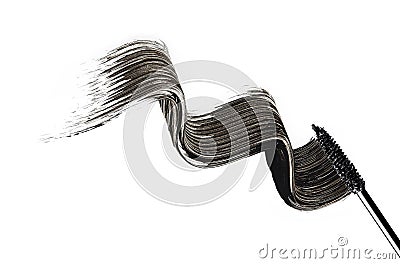 Mascara brush paints waves on a white surface Stock Photo