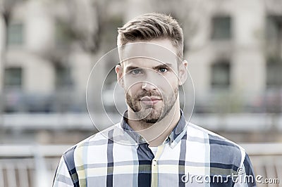 Masculine appearance. Handsome man unshaven face and stylish hair. Caucasian man urban background. Bearded man in casual Stock Photo