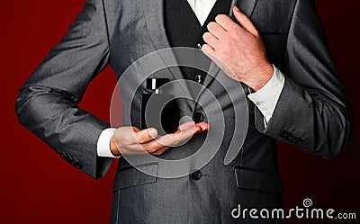 Masculine perfume. Male fragrance and perfumery. Perfume or cologne bottle. Cosmetics. Expensive suit. Rich man prefers Stock Photo