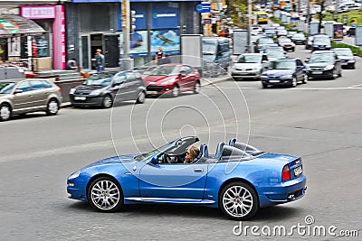 Kiev, Ukraine; April 10, 2014. Maserati Cabrio 4.2 V8. The girl behind the wheel. Editorial Stock Photo