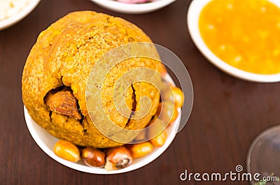 Mashed fried banana with pork meat, traditional bolon and fried corn Stock Photo