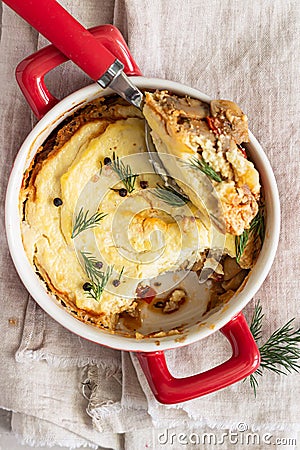 Mashed potatoes, mushrooms and seasonal vegetables casserole in baking dish. Vegetarian shepherd`s pie. Top view Stock Photo