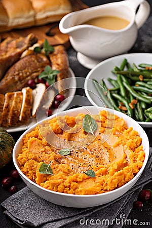 Mashed sweet potatoes on Thanksgiving table Stock Photo