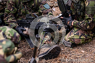 Mashine gun in hands of soldier Stock Photo