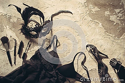 Mask, make up brushes and lace lingerie. Set of woman essential accessory and underwear on flat lay. Stock Photo