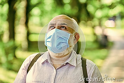 Mask protecting from virus. Wear mask. Quarantine extended. Easing of lockdown restrictions. Pandemic concept. Limit Stock Photo