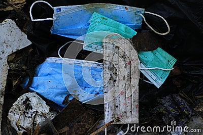 Mask waste piles up during the covid-19 pandemic in Indonesia Stock Photo