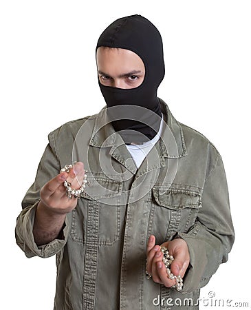 Masked burglar with jewelry Stock Photo