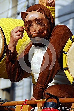 Masked character at festival Editorial Stock Photo