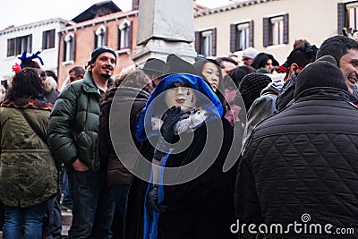 Masked face in crowd, Venice Editorial Stock Photo