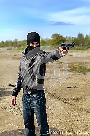 Masked gunman Stock Photo