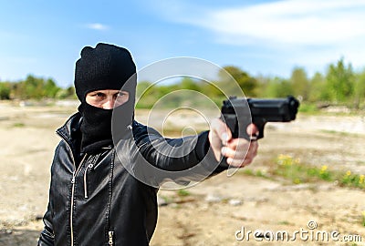 Masked gunman Stock Photo