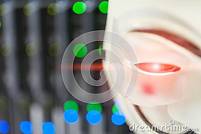 Masked Hacker in Computer Server room Concept . Editorial Stock Photo