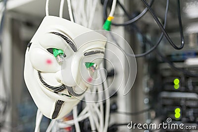 Masked Hacker in Computer Server room Concept . Editorial Stock Photo