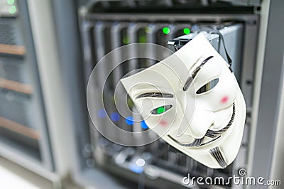 Masked Hacker in Computer Server room Concept . Editorial Stock Photo