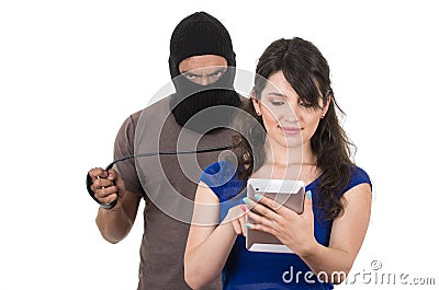 Masked male thief robbing beautiful young girl Stock Photo