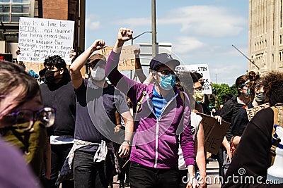 Masked Protestors Raise Fists at Protest for George Floyd Editorial Stock Photo