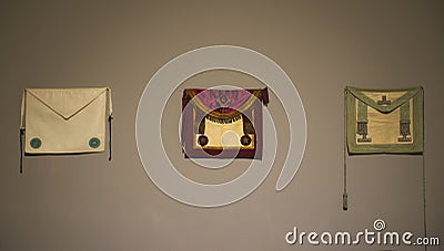 Masonic cloths on white wall in museum Stock Photo