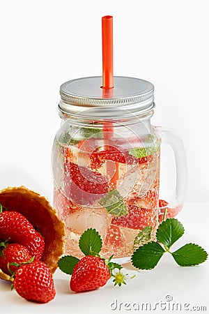 Masons Jar of iced strawberry infused water Stock Photo