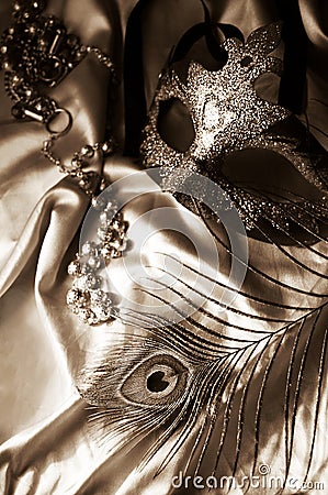 Masquerade mask, beads and feather Stock Photo