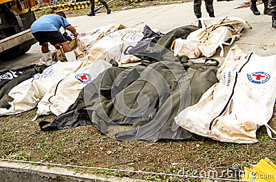 Mass grave for victims of typhoon Haiyan in Philippines Editorial Stock Photo