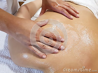 Massage back girl comfort applying professional concept therapist salon pleasure patient, wellbeing spa procedure Stock Photo