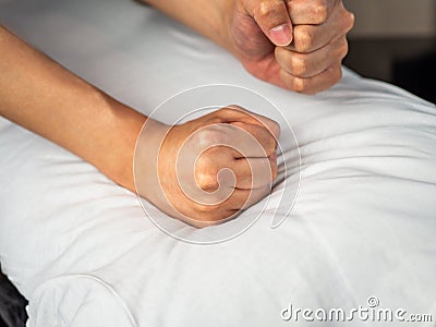 Massage back with masseur fists Stock Photo