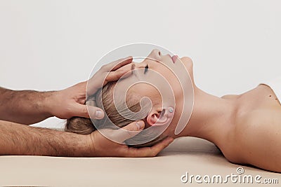 Massage of the head and cervical spine with an osteopath Stock Photo