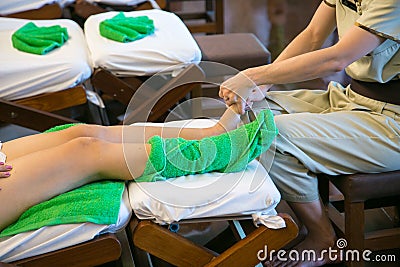 Massage of human foot in spa salon - Soft focus image Stock Photo