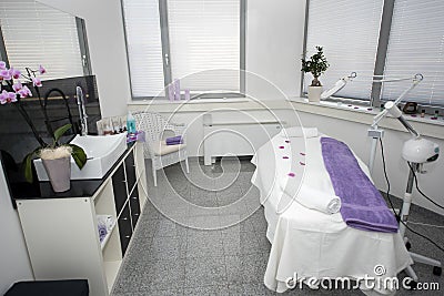 Massage table and equipment in modern beauty salon. Stock Photo