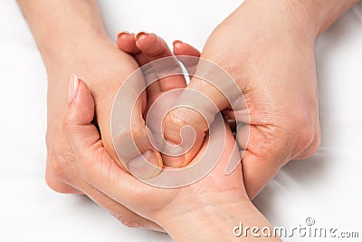 Massage therapist doing massage of hands Stock Photo