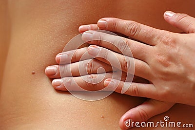Massaging hands Stock Photo
