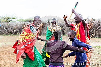 Massai family celebrating and dancing Stock Photo