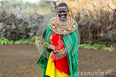 Massai woman standing in her village Stock Photo