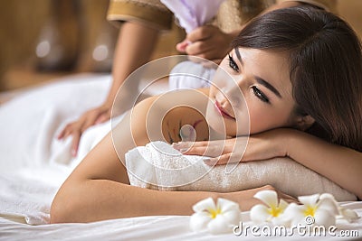 Masseur doing massage on asia woman body Stock Photo