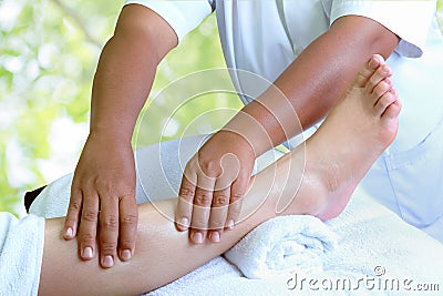 Masseur doing reflexology,Thai foot massage Stock Photo