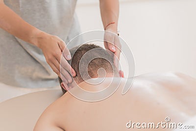 Masseur hands making relax masage Stock Photo