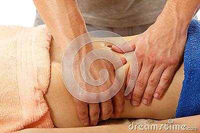 Masseur makes belly massage young woman isolated on white Stock Photo