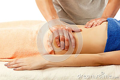 Masseur makes belly massage young woman isolated on white Stock Photo