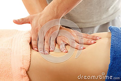 Masseur makes belly massage young woman isolated on white Stock Photo