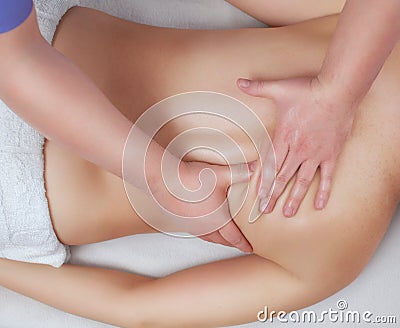 The masseur makes massage on the neck and back of the patient in the beauty salon. Stock Photo