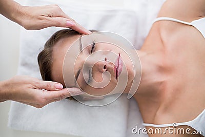 Masseur massaging woman Stock Photo