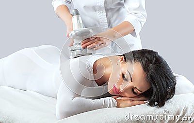 The masseur is preparing to make an hardware anti-cellulite massage Stock Photo