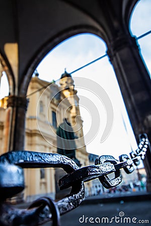 A massive chain of the feldherrenhalle odeonsplatz in munich with the theatine church in the background Stock Photo