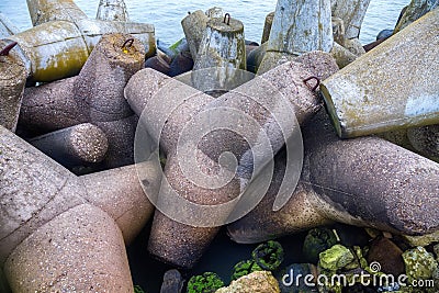 Massive concrete breakwaters to protect the coast from the destructive effects of sea waves Stock Photo