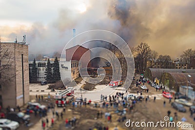 Massive large blaze fire in the city, aerial drone top view brick factory building on fire, hell major fire explosion flame blast Editorial Stock Photo